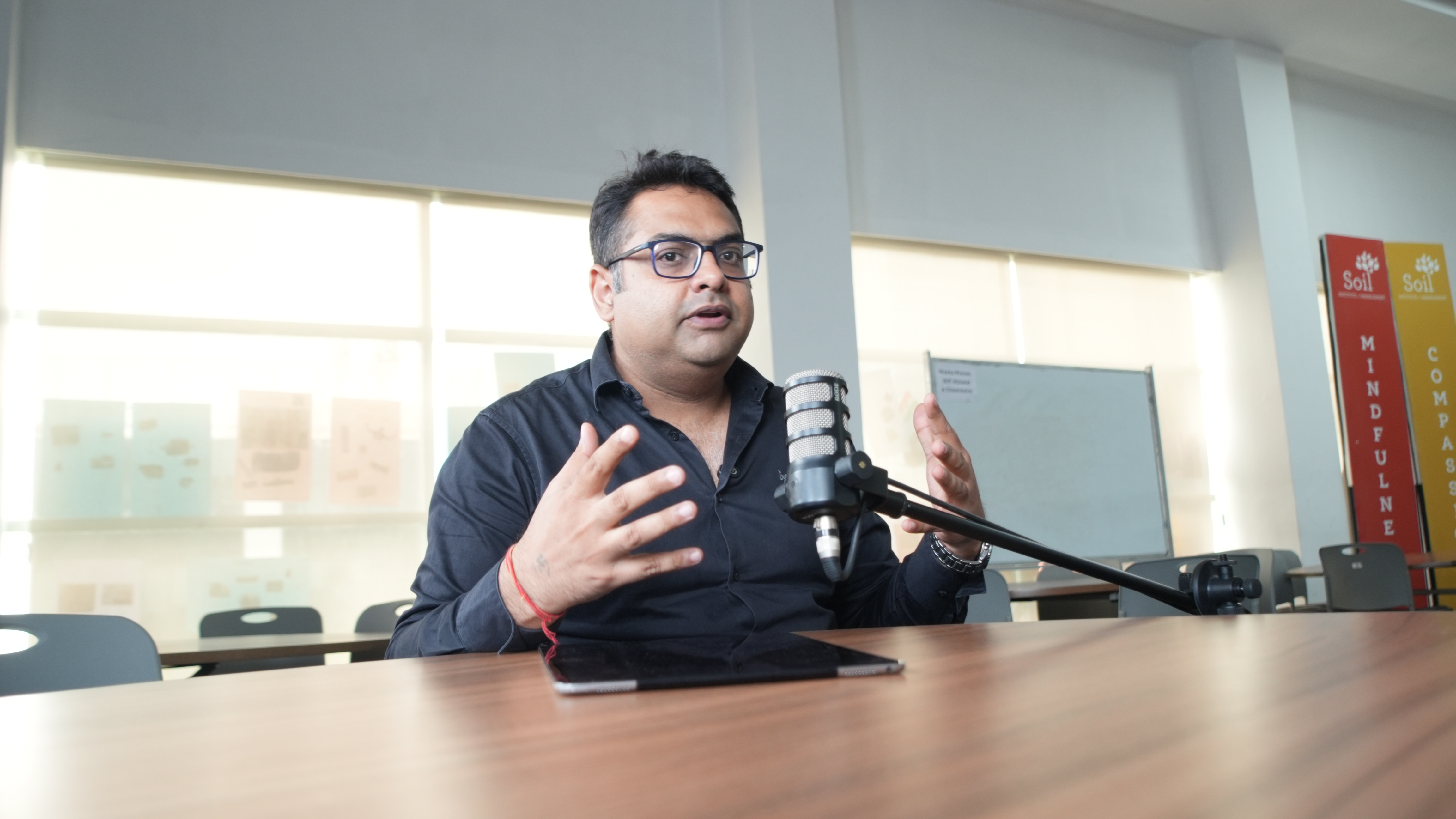 A studio microphone and headphones